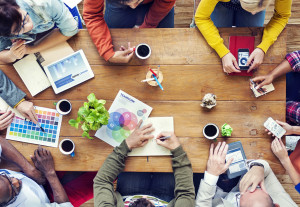 group of people around table in a design meeting