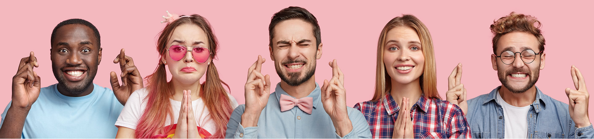 diverse group of people with fingers crosses or hands in prayer position